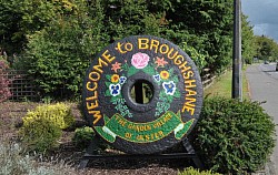 Stone Wheel Welcoming Vistors to Broughshane in Garden of O’Kane Hatchery in Broughshane.