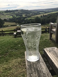 Glass of Lemonade and Lime at view of countryside around Bradsfield
